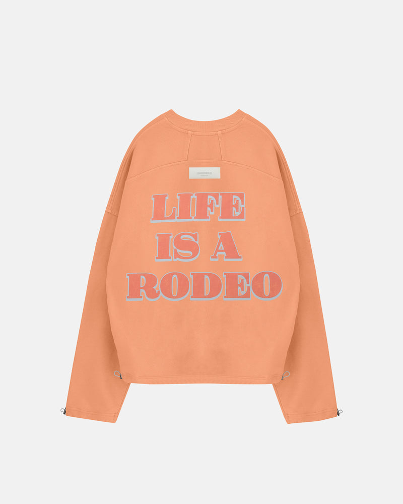 Rodeo "Life is a Rodeo" Crewneck Orange
